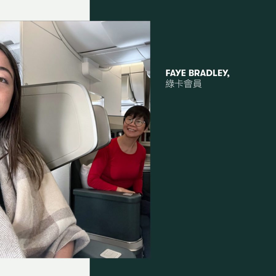 Two smiling women sat in business on board a Cathay Pacific flight